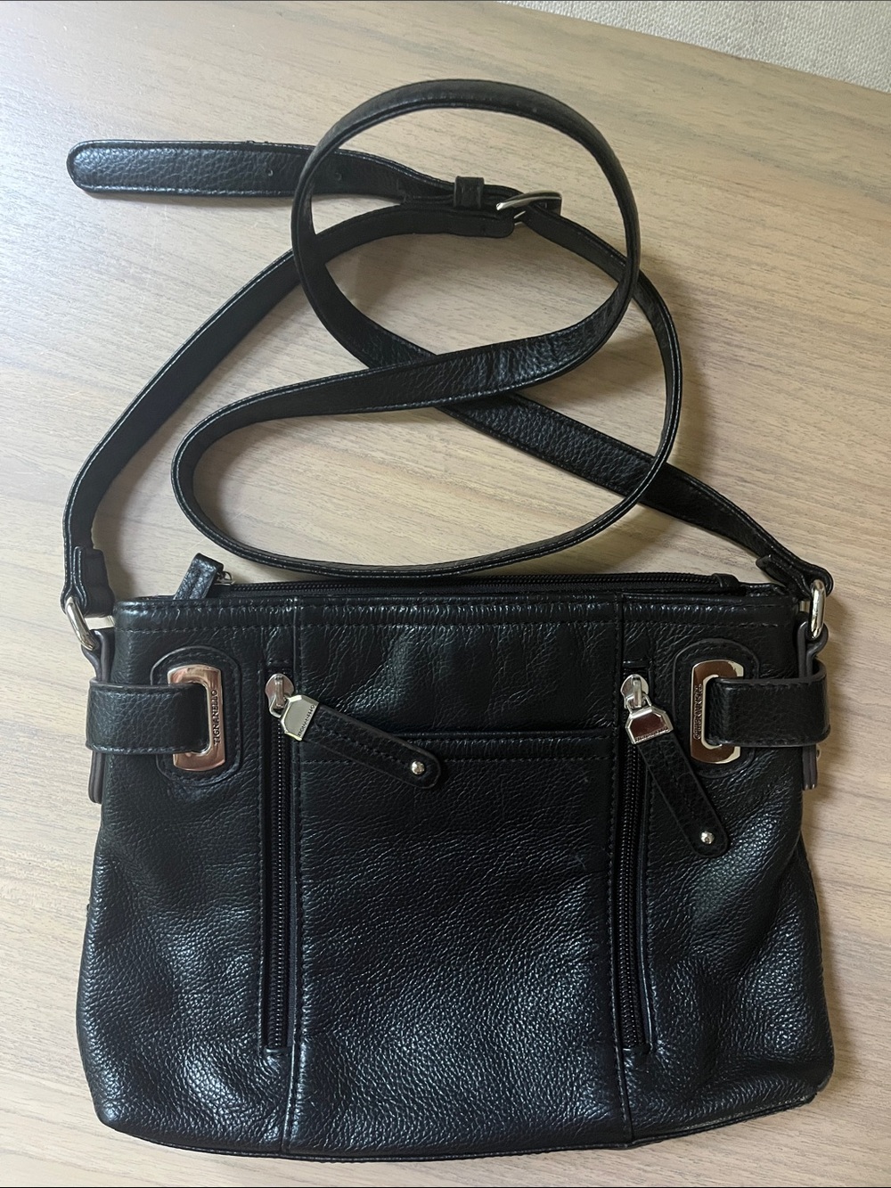 Tignanello black leather purse with colorful stripe inside